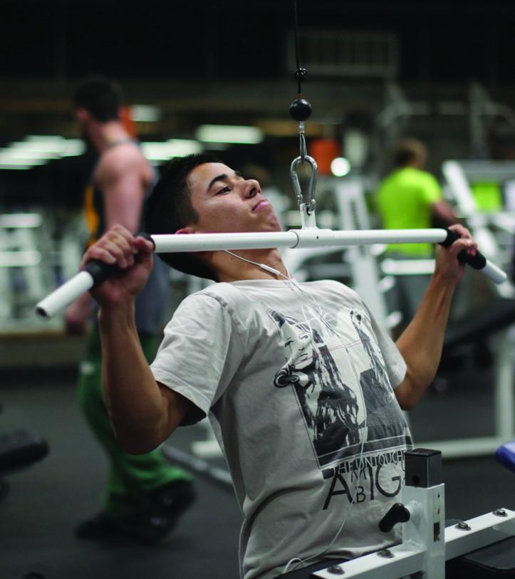 Paul Coduti-Business and Psychology major works on his lats.  Photo by Stephen Badger The Broadside