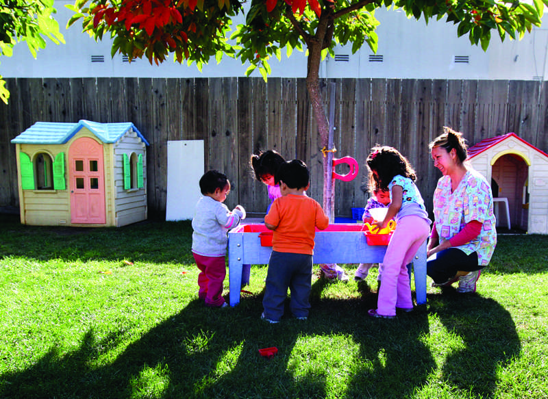 Lupita Fernandez, right, watches over her charges at her Migrant Head Start childcare at her Watsonville, California home, November 2, 2011. (Shmuel Thaler/Santa Cruz Sentinel/MCT)