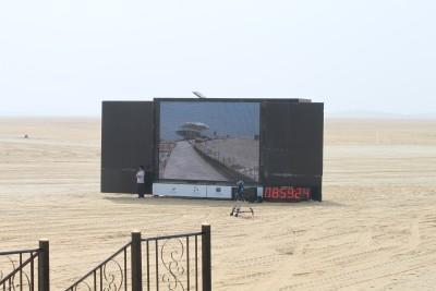 One of seveal big viewing screens set up in the desert for the crowd to view the falcon races.  Photo submitted by Dan Cecchini.