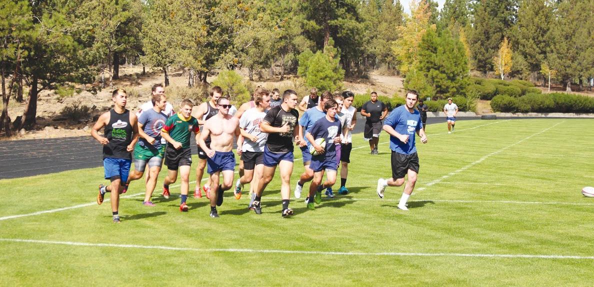 The Bobcats do a quick warm-up lap before starting practice.