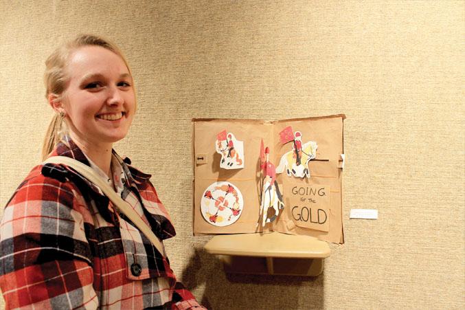 Amanda Blair, Sculpture 1, shows off her pop-up project, “Going for the Gold.” Blair based her project off her equestrian team experience while she attended Redmond High and described that they were the state champions in 2013. Blair is now studying towards a bachelor in fine arts at OSU-Cascades.  