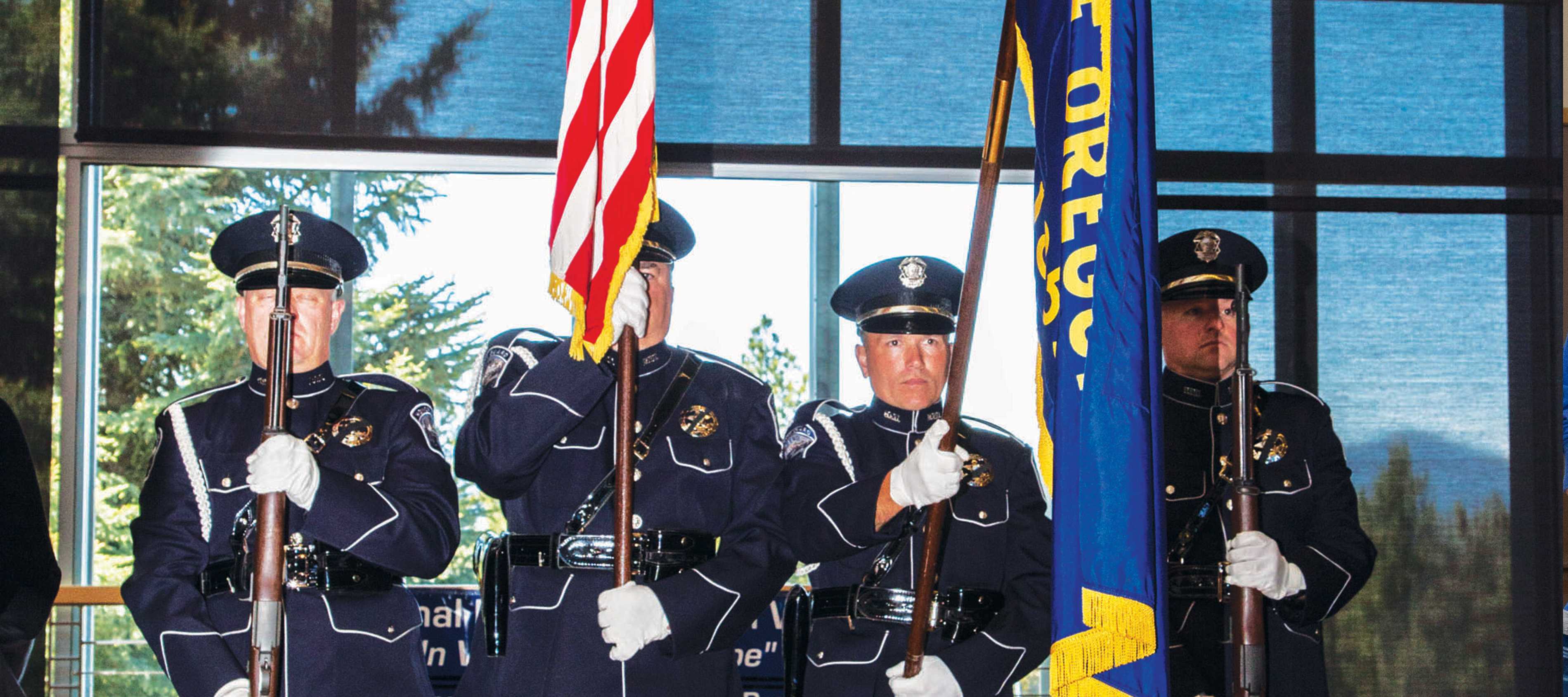 Bend Police officers present a commemorative wreath at memorial service. | Photo by Eugene Helmbrecht