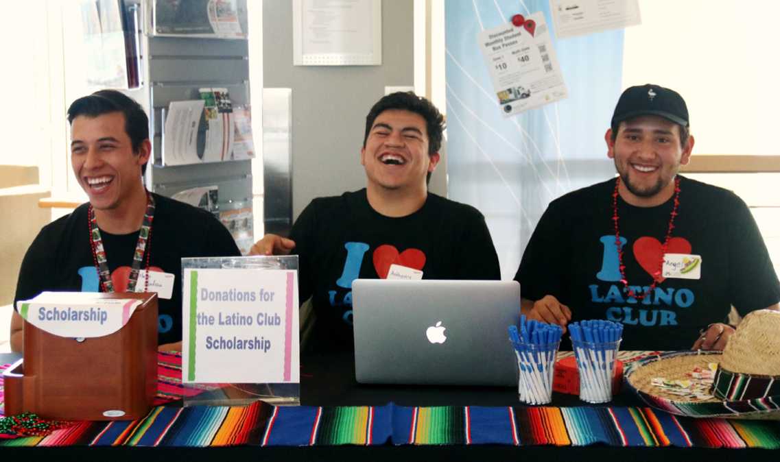 Members of the Latino Club greet attendees at the Latino Fiesta. From left to right: Martin Mendoza, Anthony Estrada, and Angel Ortiz.