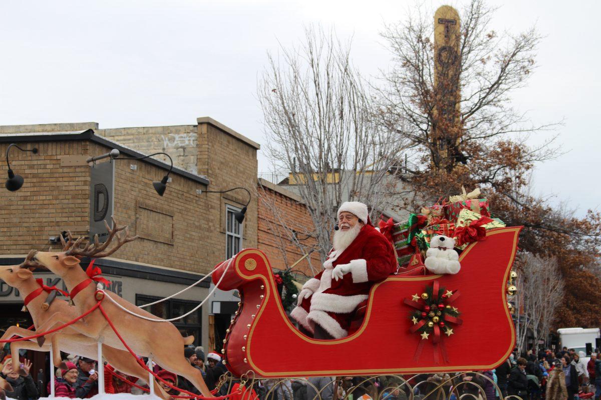 Santa rides down Wall St. and greets the people of Bend, Saturday, Dec. 7, 2019 (For The Broadside/Luke Reynolds)