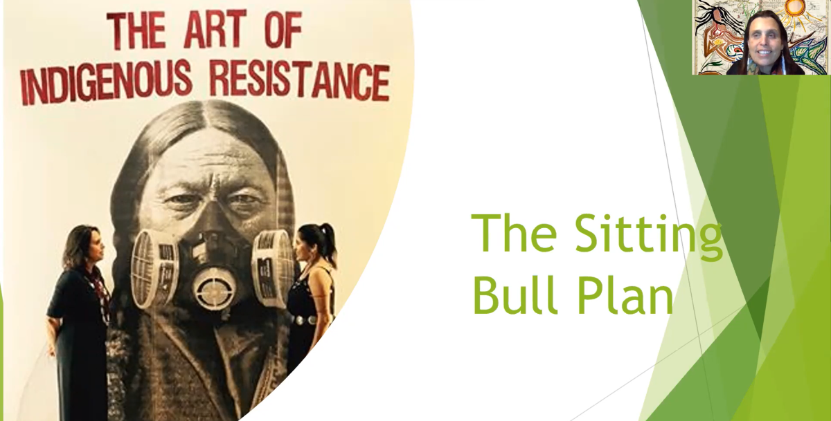 Winona+LaDuke+in+front+of+a+presentation+slide+that+says+The+Sitting+Bull+Plan