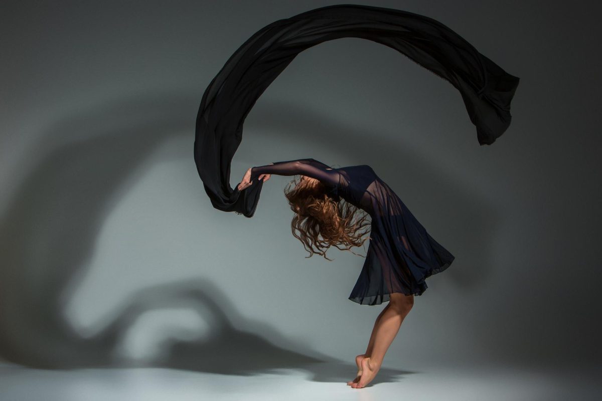Contemporary dancer performing with flowing fabric